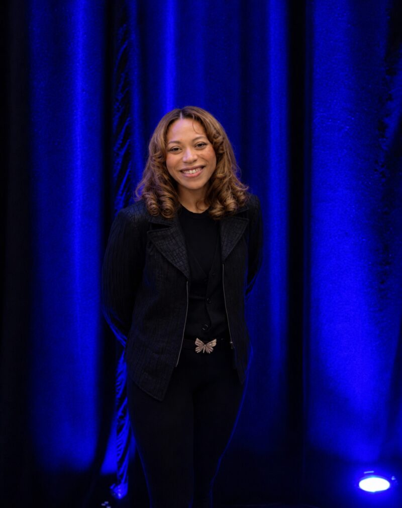 Inspire Core's Founder and CEO on stage at a leadership conference