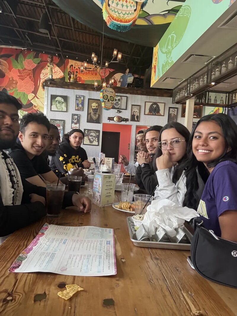 Inspire Core team members gathered around a table at a restaurant